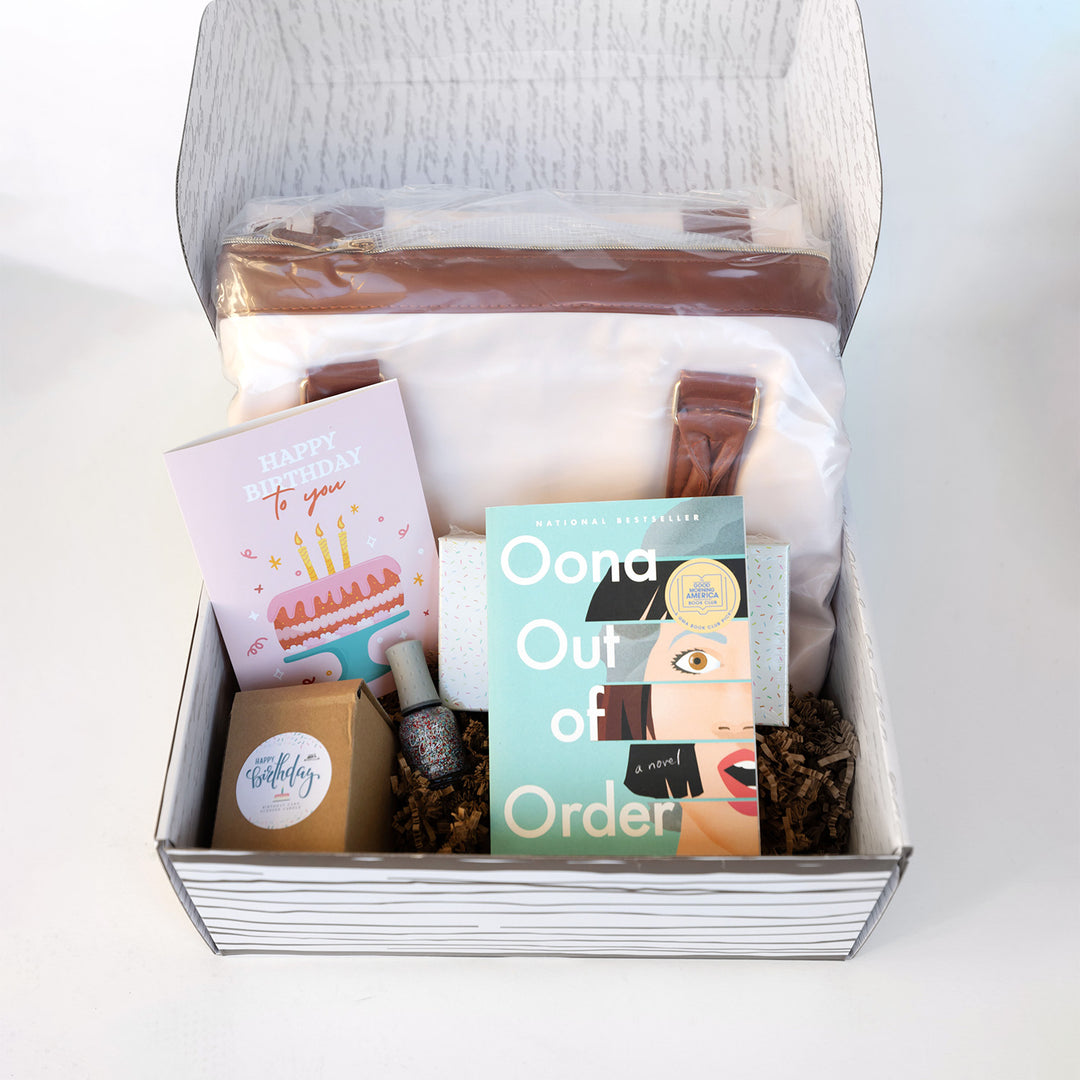 An open Birthday Box reveals a copy of Oona Out of Order and other items.