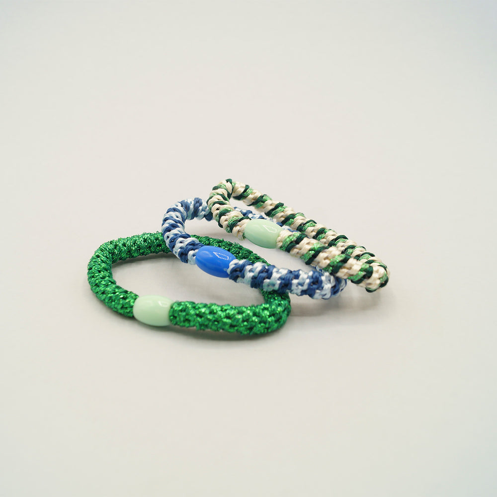 a set of three stretchy elastic bracelets.