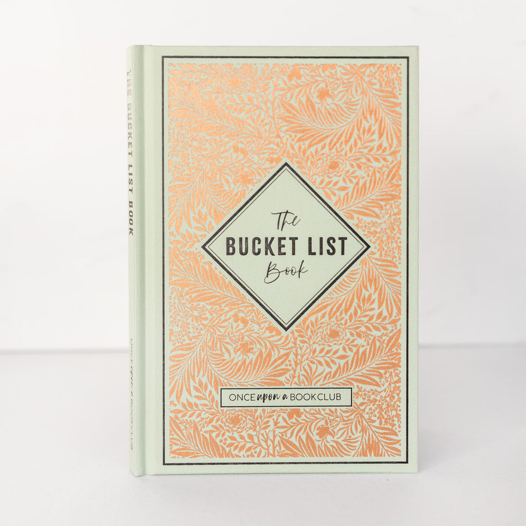 a light green fabric covered Bucket List book with navy blue text accents and copper toned floral foiling.