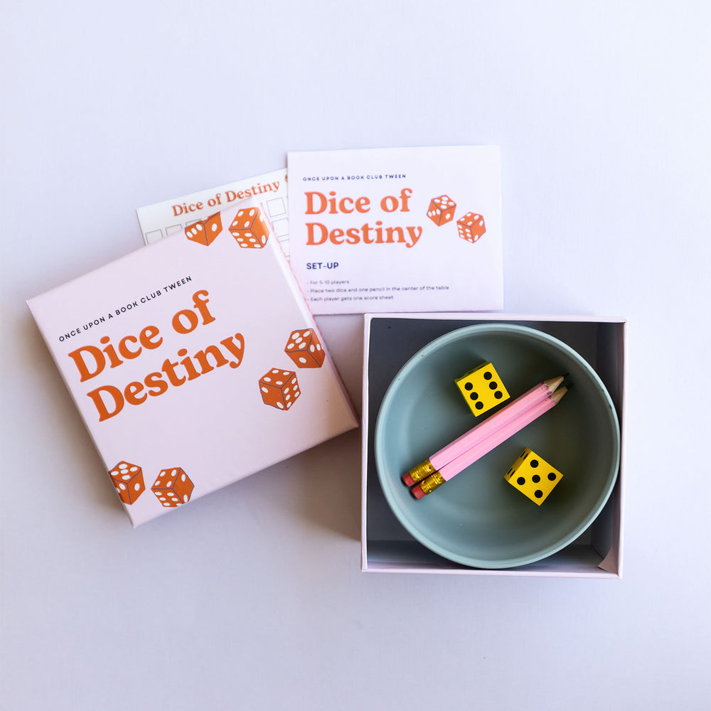 the dice of destiny game with pencils, dice, a bowl, instructions, and the scorecard.