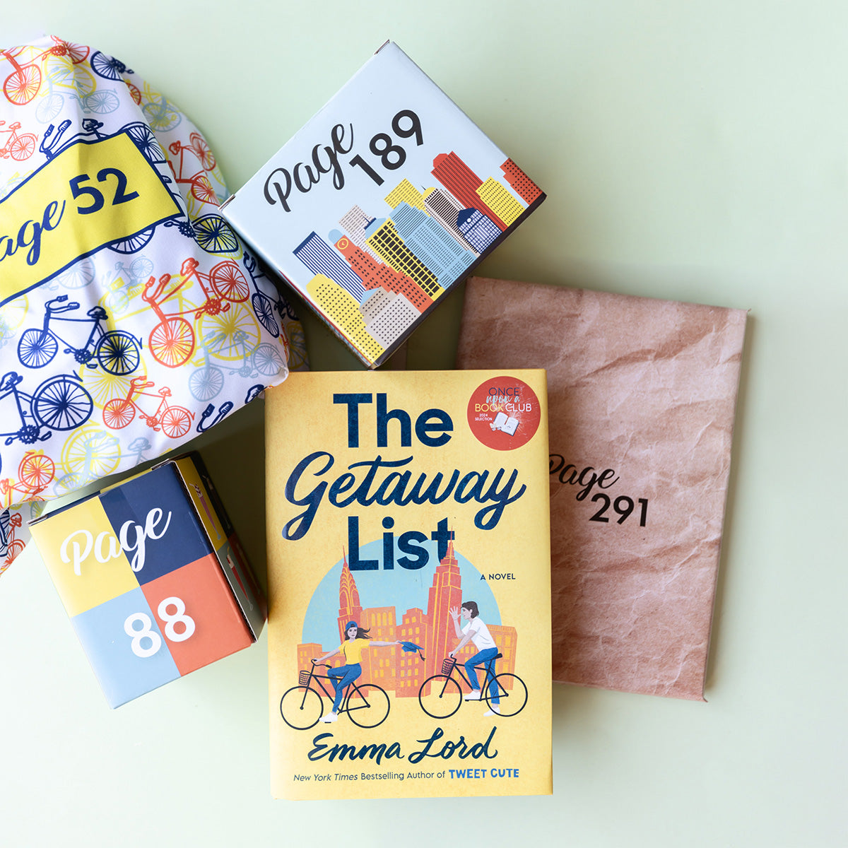 The Getaway List book with colorful, themed packages labeled by page numbers for gifts.