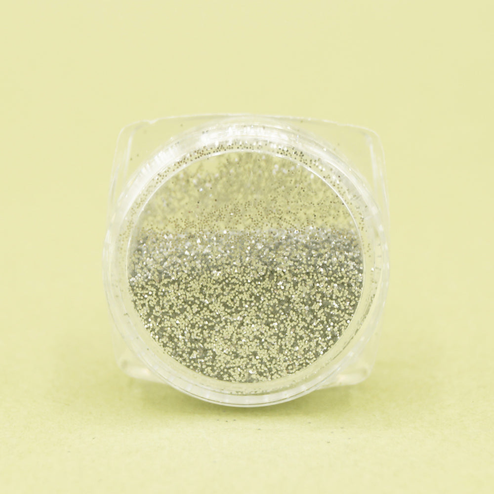 a side view of the pot of silver glitter eyeshadow.