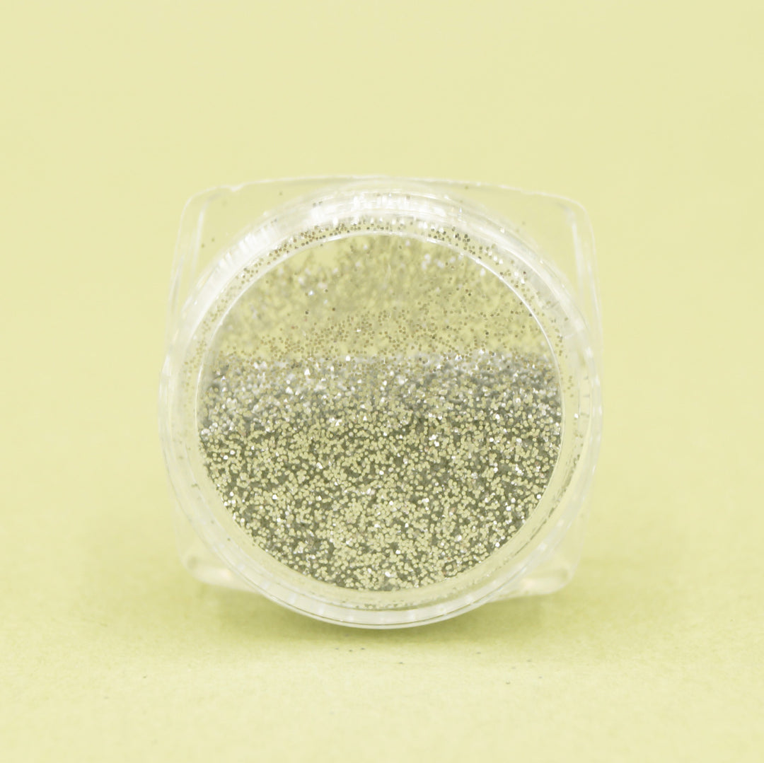 a side view of the pot of silver glitter eyeshadow.