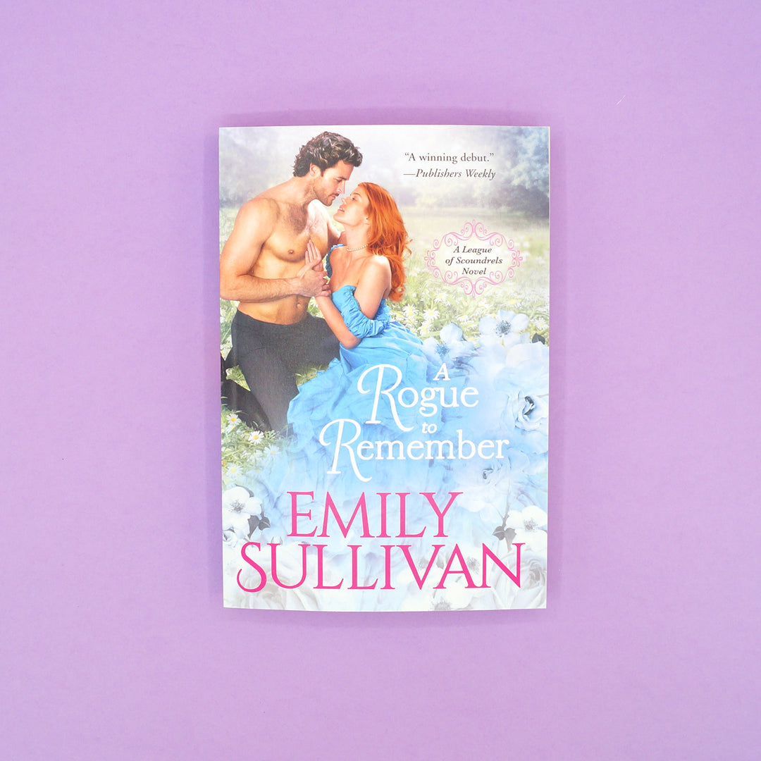 A mass market paperback copy of "A Rogue to Remember" by Emily Sullivan.