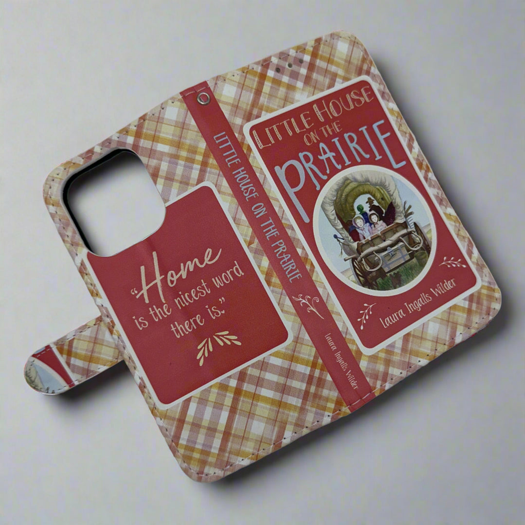 The front and back of a book shaped phone case inspired by Little House on the Prairie by Laura Ingalls Wilder.
