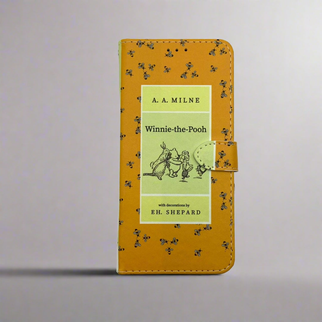 The front cover of a book-shaped phone case inspired by Winnie-the-Pooh by A.A. Milne.