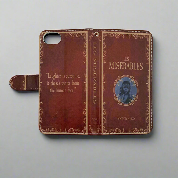 The front and back of a book shaped phone case inspired by Les Miserables by Victor Hugo.