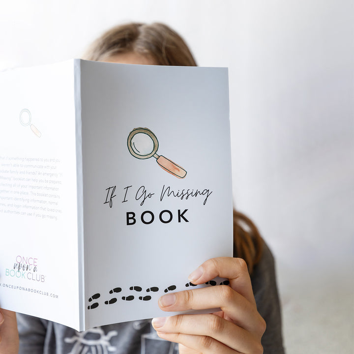 a girl holds a light blue notebook with the text If I Go Missing Book on the cover. Above the text is a drawing of a magnifying glass and below are a trail of black footprints.