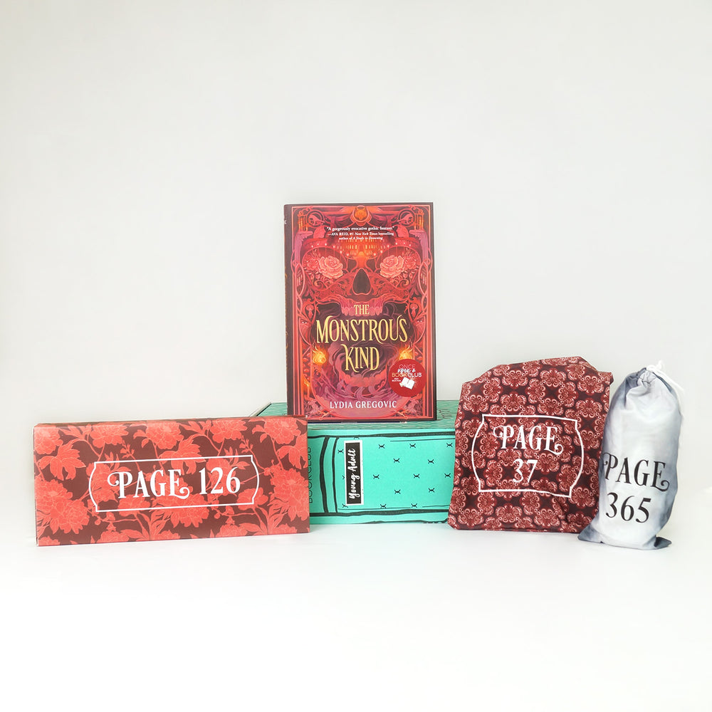 A hardcover copy of A Monstrous Kind by Lydia Gregovic sits on a green Once Upon a Book Club box and is surrounded by wrapped gifts labeled with page numbers matching the color palette of book