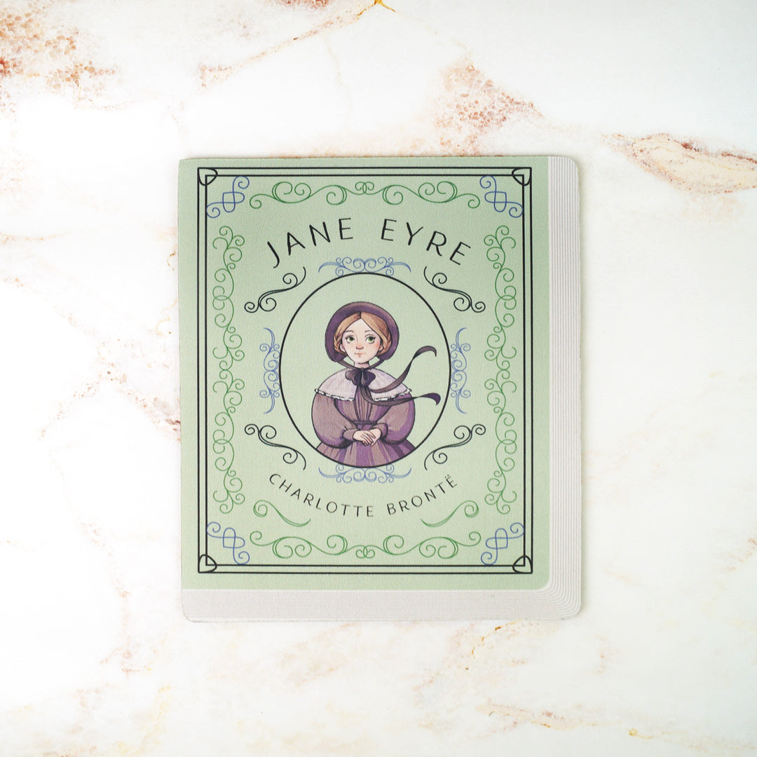 A light green mouse pad meant to look like the book cover of Jane Eyre featuring an illustration of Jane in the center.