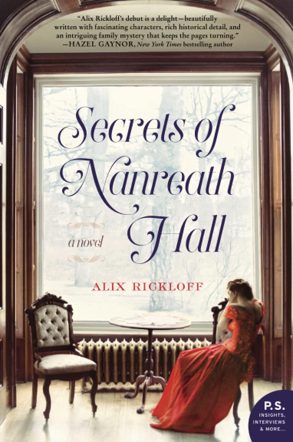 The paperback book cover of Secrets of Nanreath Hall by Alix Rickloff. The book cover features a woman in a vintage red dress looking out an oversized window framed with dark wood. She sits in an ornate wooden chair with a small round table between another, empty chair. Beneath the window is an old style radiator. Outside the window, the silhouette of trees can be seen behind the book title.