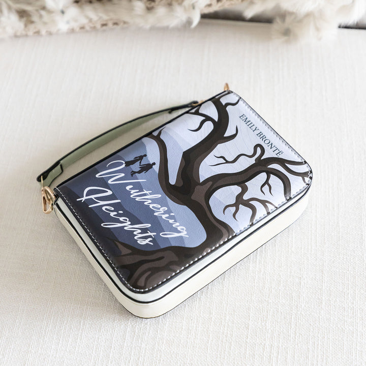 A book-shaped purse inspired by Wuthering Heights by Emily Brontë. The purse lays at a slight angle with the front cover facing up toward the camera.