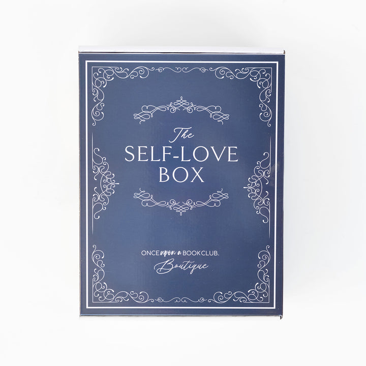 A navy blue Self-Love box sits on a white background.