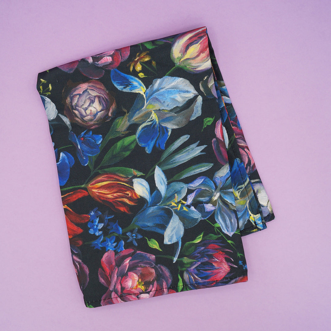 A multicolored, floral tea towel.