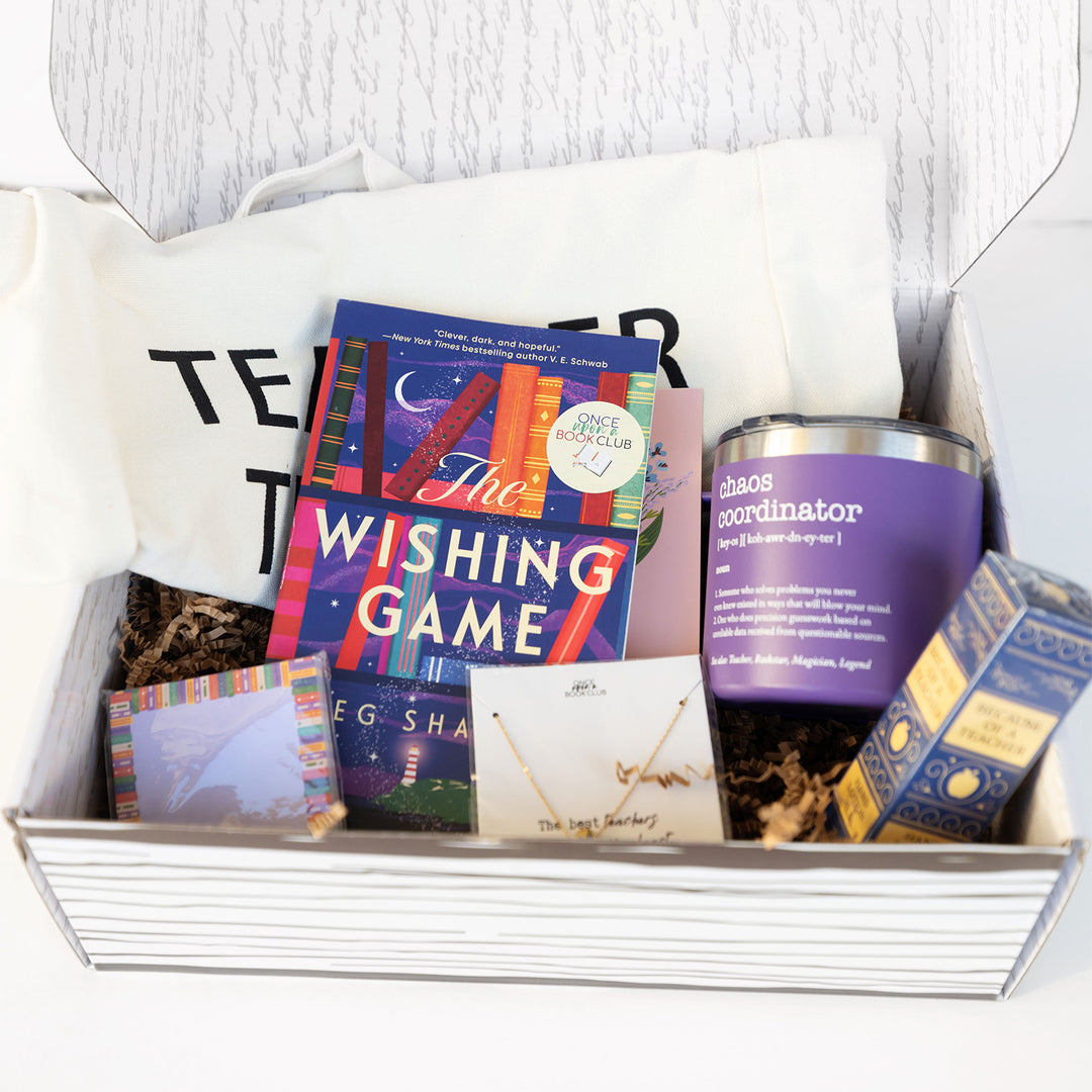 An open Teacher Care Package showing a copy of The Wishing Game and additional items.